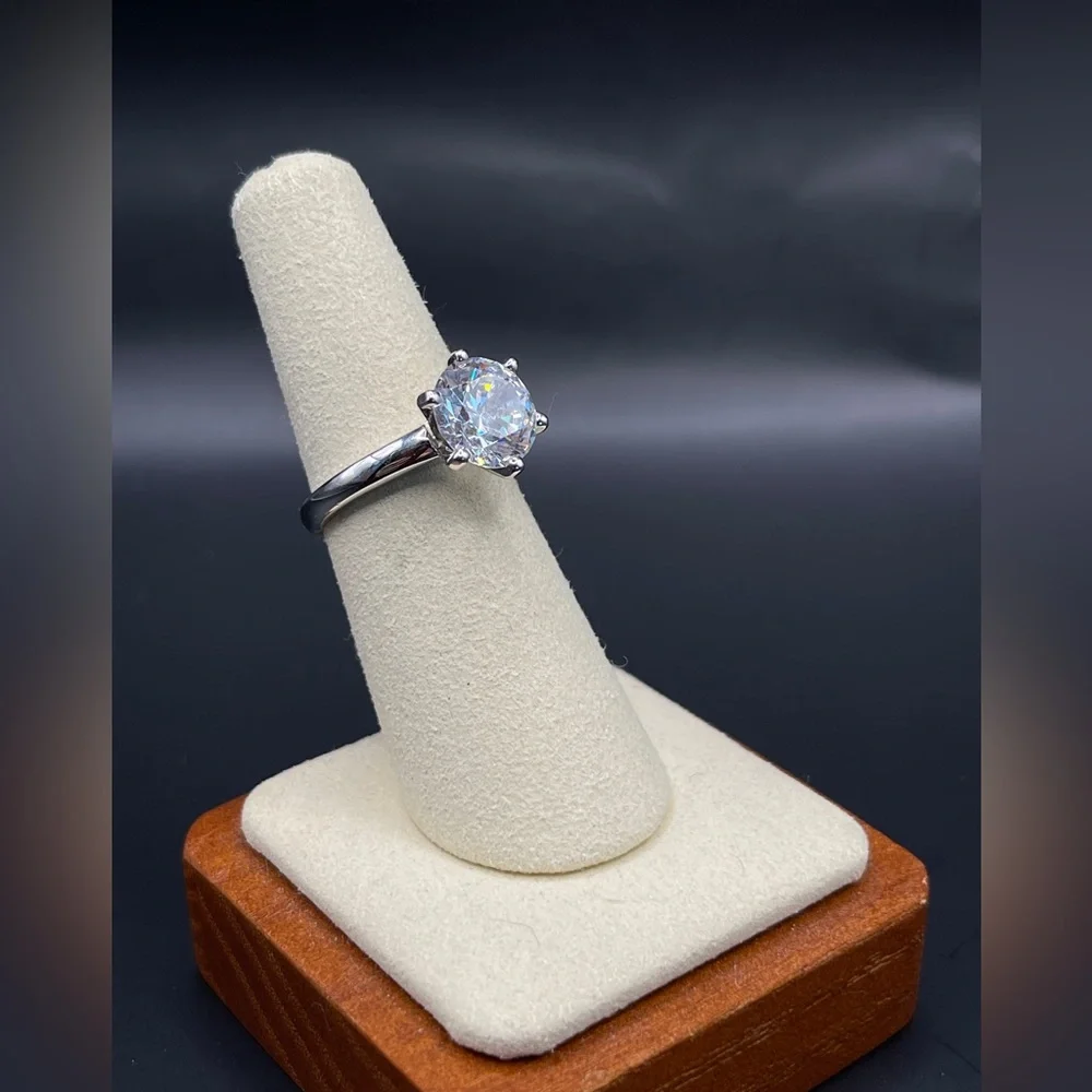 Two (2) carat cz solitaire in a 925 sterling silver setting. Size 6.25.